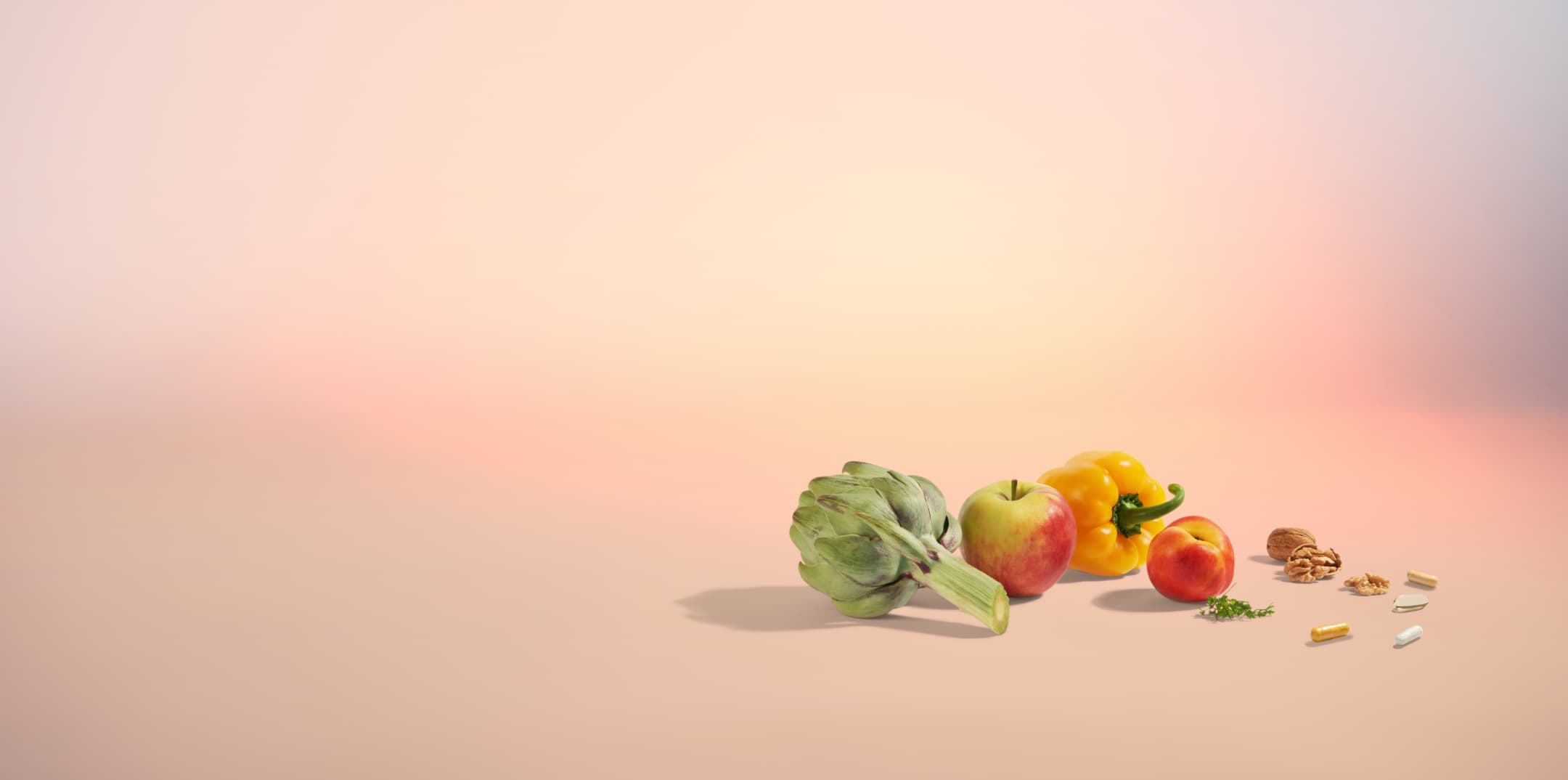 An image of fruit and vegetables on a orange background